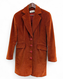 Brown velvet coat on a hanger against a white background