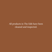 Brown background with white text stating 'All products in The Edit have been cleaned and inspected.'